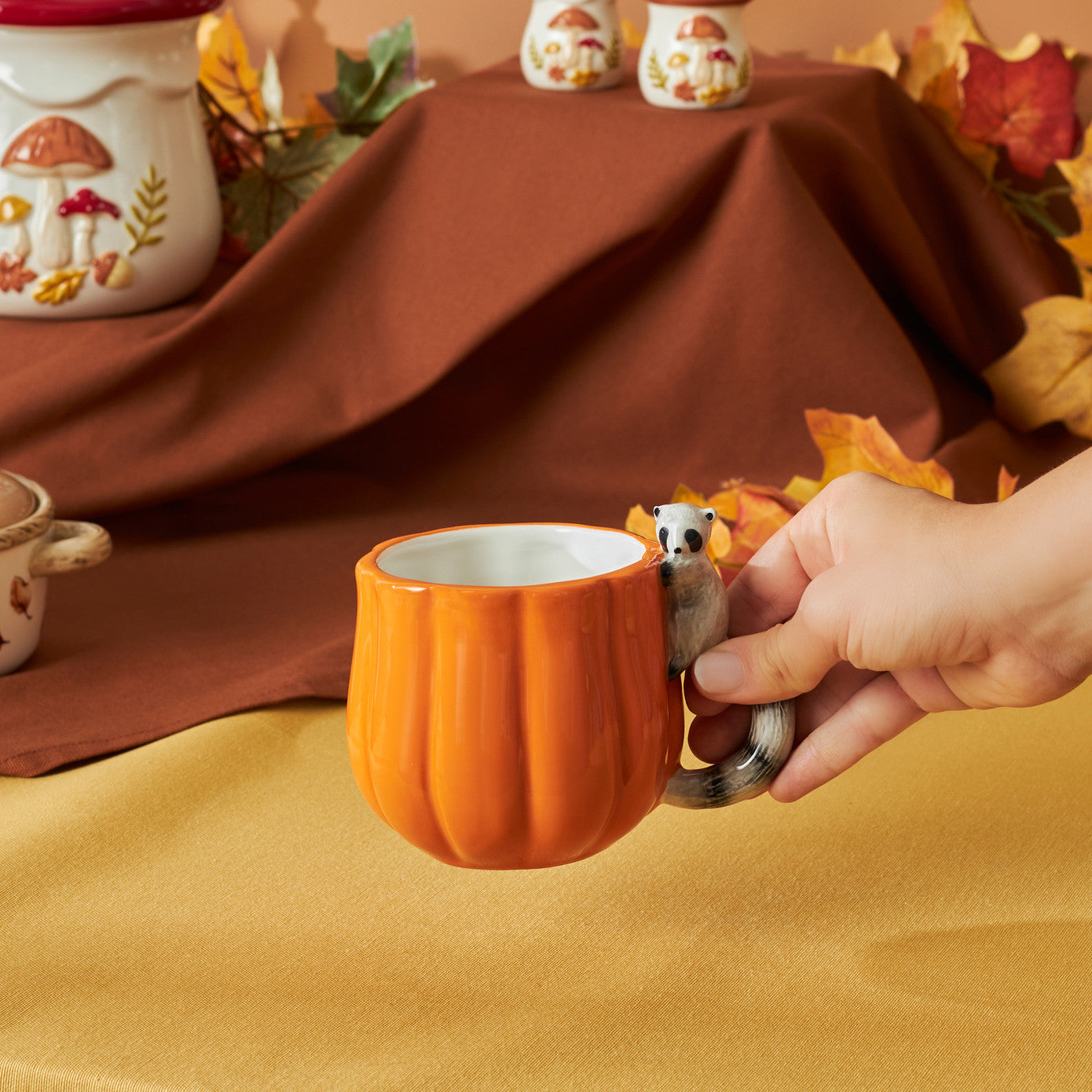Cozy Pumpkin Raccoon Mug 320 ml
