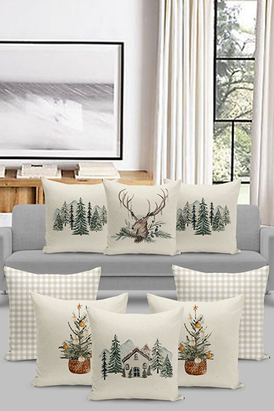 Set of decorative pillows with nature-themed designs on a gray sofa. deer, house, treee, 