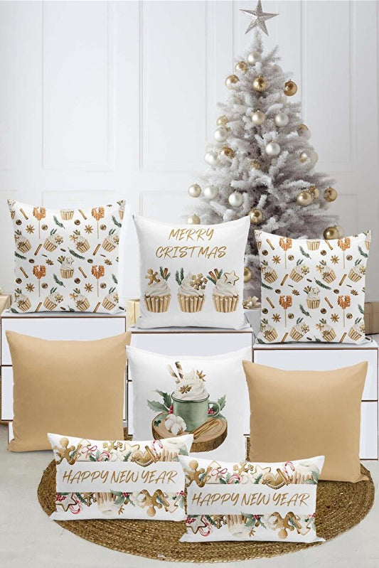 Decorative pillows with Christmas and New Year text in front of a decorated Christmas tree.