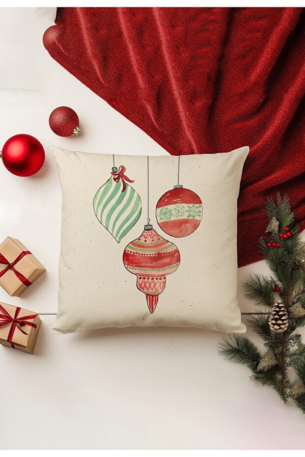 Decorative pillow with Christmas ornaments on a red fabric background